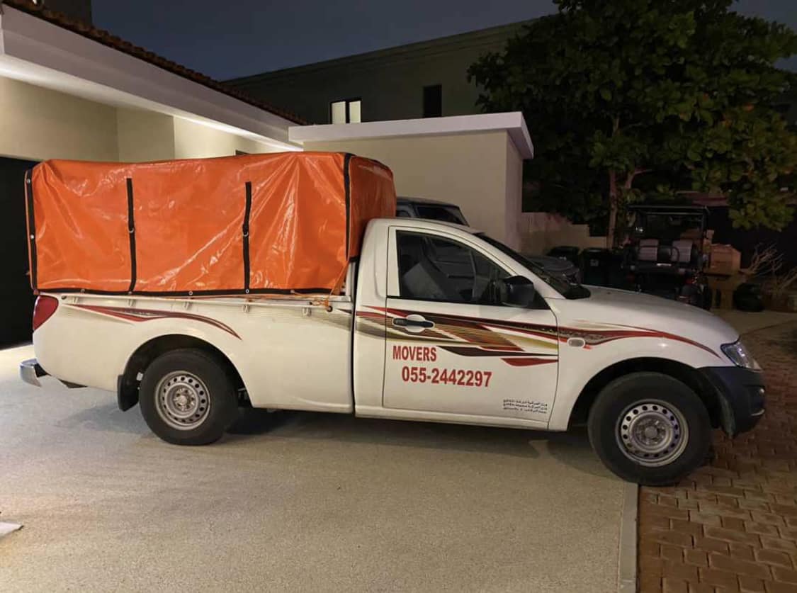 Faisal Movers team relocating office equipment in Dubai